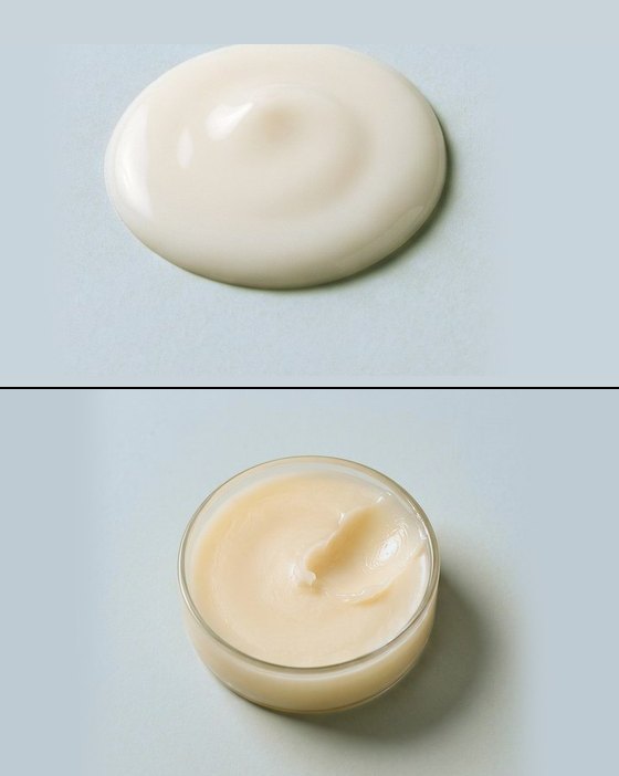 Uma porção de creme branco e, embaixo, um pote de vidro aberto com pomada